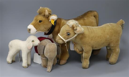 A Steiff cow with bell, Bertha, no. 072963, button in ear and three other Steiff toys,